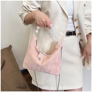 Pink pleated cloud bag with white pearl handle and silver chain strap detail