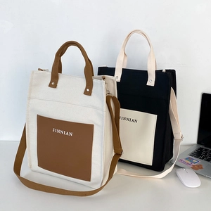 Large color-block canvas tote bag with front pocket and shoulder strap for daily commuting