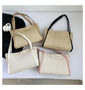 Overhead view showing four color options of large woven tote bags for summer beach trips