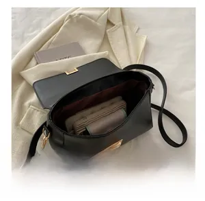 Detail view of the spacious black faux leather interior showing ample storage for a wallet