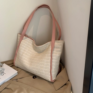 Large woven tote bag with pink straps and cream wave texture for summer beach outings