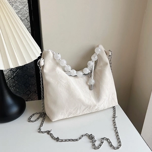 Elegant cream pleated cloud bag with transparent bead handle and silver chain strap