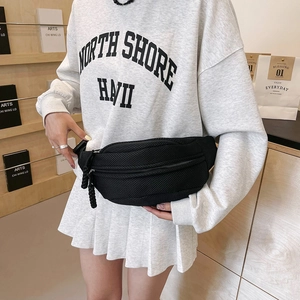 Detail of black mesh crossbody bag with dual zipper pulls and sporty woven cords