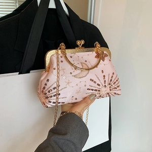 Pink sequin Chinese style evening bag with gold celestial embroidery and metal frame handle