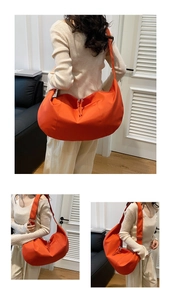 Three-way view of bright orange nylon dumpling crossbody bag with adjustable strap