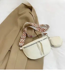 Detail of white litchi pattern waist bag with striped strap and mini coin purse pouch