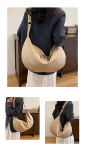 Multiple views of a beige crescent crossbody bag showing its large capacity and minimalist style