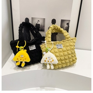Quilted puff tote bags in black and lime green colors with cute mushroom charms