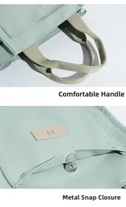 Detail of mint green canvas tote bag showing top handle and magnetic metal snap closure