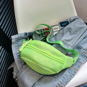 Detail of neon green mesh chest bag with breathable fabric and adjustable nylon strap