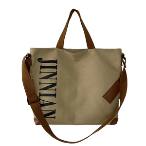 Sac fourre-tout en toile kaki avec anses marron et lettrage JINNIAN au design minimaliste