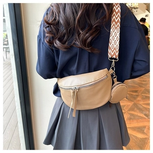 Detail of khaki pebbled leather crossbody bag with jacquard strap and mini coin purse