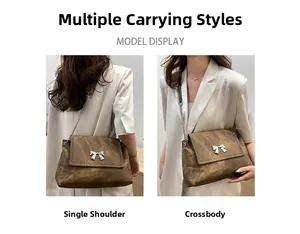 Brown textured tote bag featuring a silver butterfly clasp and versatile metal chain strap