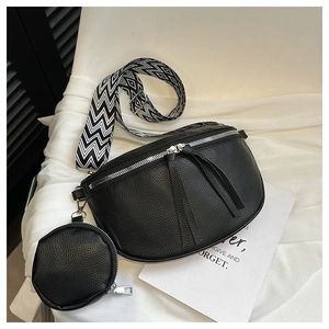 Detail of black pebbled leather waist bag with geometric strap and round coin purse