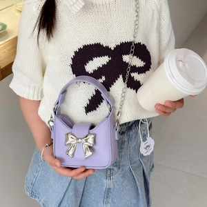 Kids lavender mini crossbody bag with a metallic silver bow and chain strap for girls