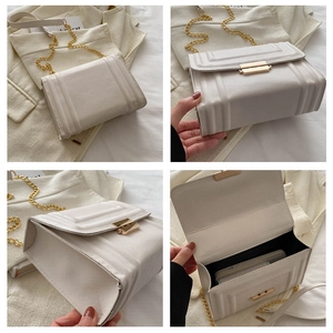 Detail view of white textured crossbody bag with gold chain and interior storage space