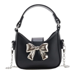 Mini black leather kids handbag featuring a silver metal bow and elegant chain strap