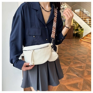 White pebble leather crescent crossbody bag with small coin purse and geometric strap