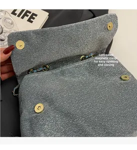Close-up of invisible magnetic closure on silver sequin chain bag for easy opening