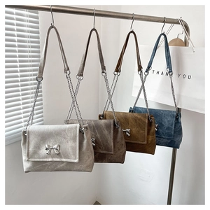 Four colors of faux leather tote bags with metal butterfly chain and crossbody strap