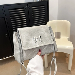 Grey denim tote bag with silver butterfly buckle and chain strap for women
