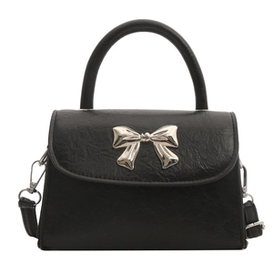 Elegant black PU leather handbag with silver bow detail and detachable shoulder strap