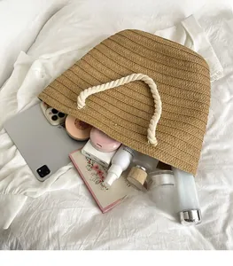 Interior view of large woven tote bag showing spacious storage for tablet and cosmetics