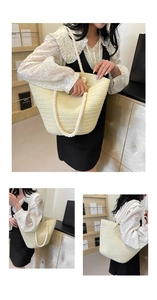 Detailed macro view of woven beige straw tote bag with thick rope handle