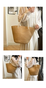 Detail of a beige woven tote bag featuring soft white rope handles and textured fabric