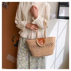 Detailed close-up of woven cotton tote bag with colorful polka dots and pearl button closure