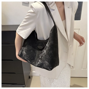 Detail showing distressed silver splatter texture on large black hobo tote shoulder bag