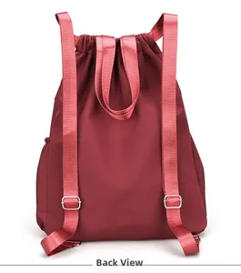 Detailed back view of a burgundy waterproof backpack with adjustable straps and drawstring