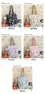 Detail of five-color canvas tote bags with cartoon bear print and adjustable straps