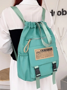 Mint green nylon drawstring backpack with adjustable straps for school or travel