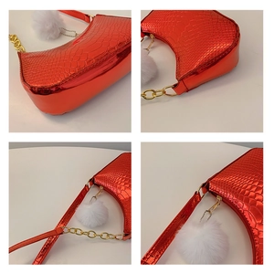 Detailed views of red crocodile pattern shoulder bag with gold chain and white fur ball