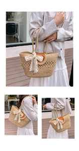 Close-up of woven cotton tote bag with white lace bow detail and brown leather flap closure