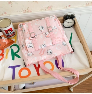 Pink canvas tote bag featuring cute white bear prints and wide shoulder straps detail