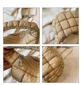 Close-up of beige puffer bag showing quilted texture, metal zipper and stitching detail