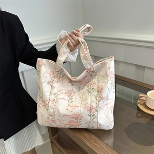 Elegante borsa tote in tela color crema con stampa floreale rosa per il pendolarismo