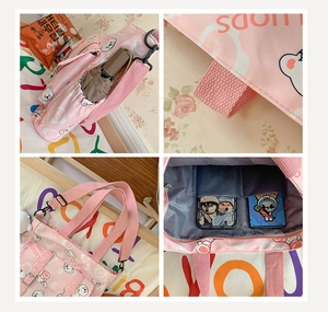 Close-up detail of pink cartoon tote bag showing side pockets and interior storage