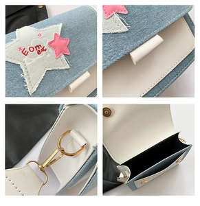 Detail of denim and leather patchwork crossbody bag with star patches and gold hardware
