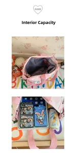Detailed view of pink canvas tote bag showing interior capacity with tablet and umbrella