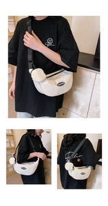 Detail of white nylon crescent bag showing the adjustable strap and small coin pouch attachment