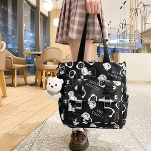 Harajuku style black nylon tote bag with cartoon bear print and plush charm