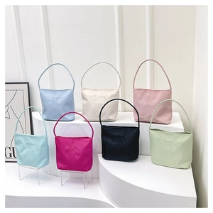 Detailed display of a nylon tote bag available in seven trendy colors with a smooth finish