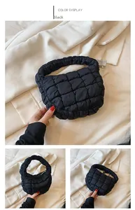 Detail of black quilted cloud bag showing the soft texture and puffy pleated handle
