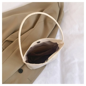 Overhead view of nylon tote bag interior with magnetic snap closure and zipper pocket