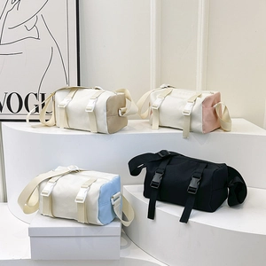 Minimalist cylinder messenger bags for men and women in four assorted stylish colors