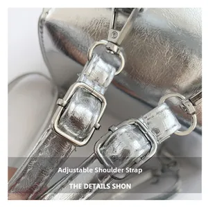 Detailed macro view of silver textured leather flap bag with adjustable metal buckle