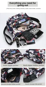 Deep blue floral nylon crossbody bag with multiple zipper compartments for iPad and umbrella